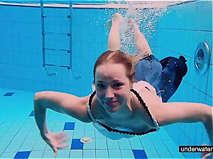 teenager doll Avenna is swimming in the pool